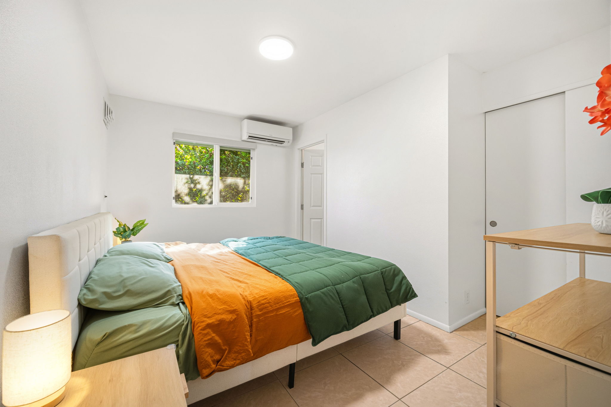 6250 Olohena Road, Unit 2 Kapaa, HI 96746 - Photo 12 of 29 a bedroom with a bed and a window