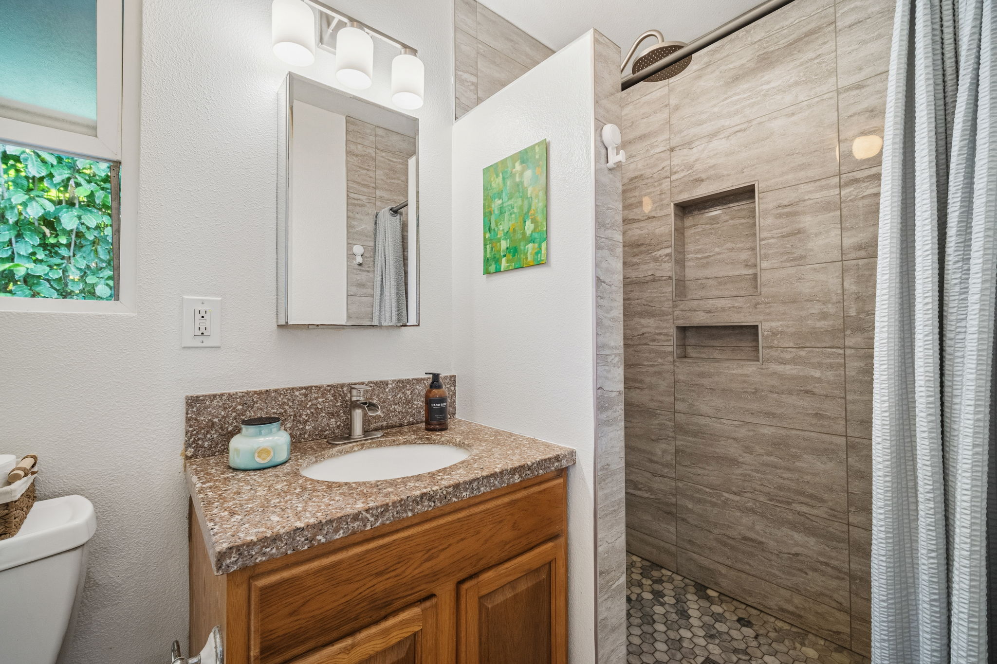 6250 Olohena Road, Unit 2 Kapaa, HI 96746 - Photo 13 of 29 a bathroom with a granite countertop sink a toilet and shower