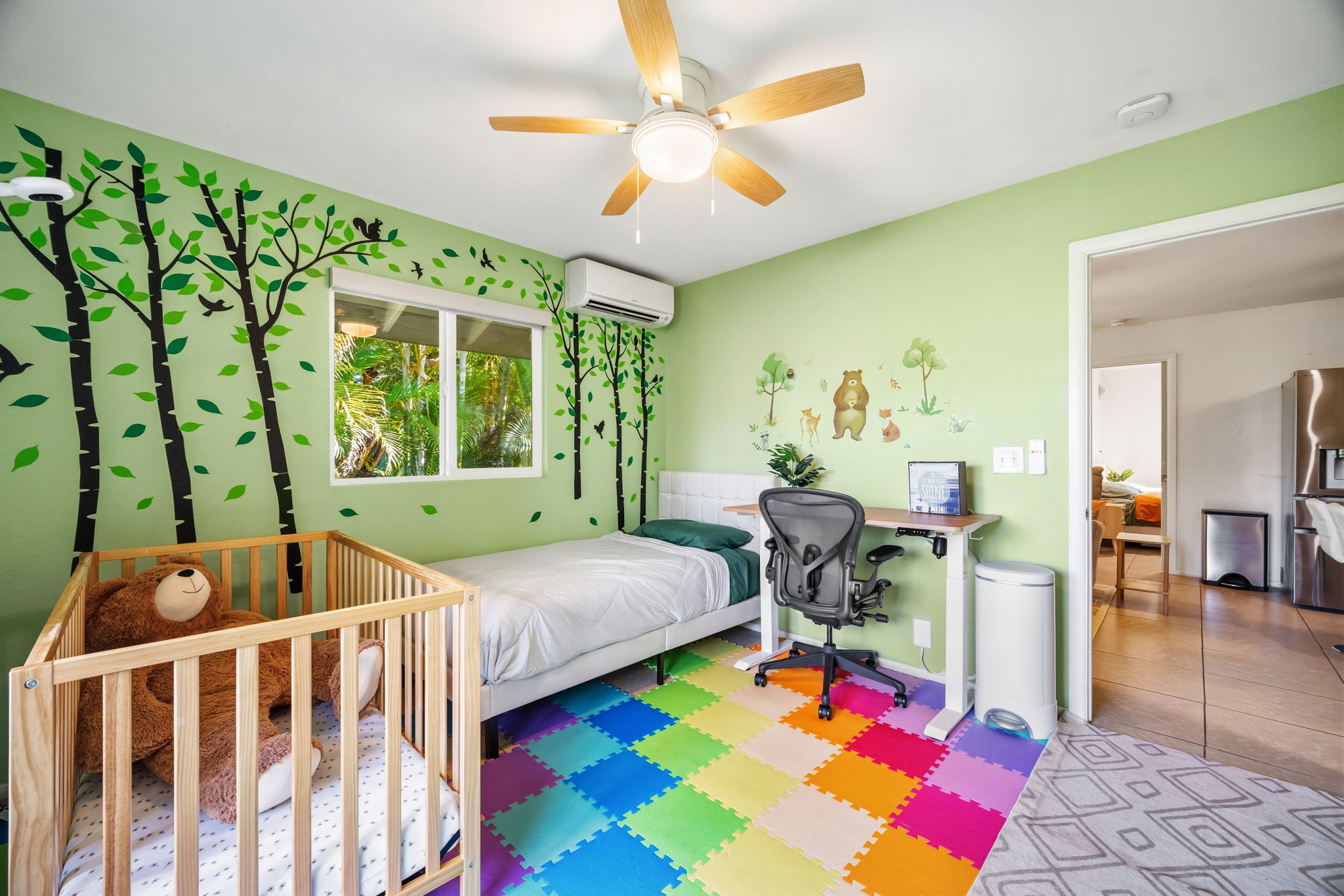 6250 Olohena Road, Unit 2 Kapaa, HI 96746 - Photo 15 of 29 a bedroom with a bed and a table with rug