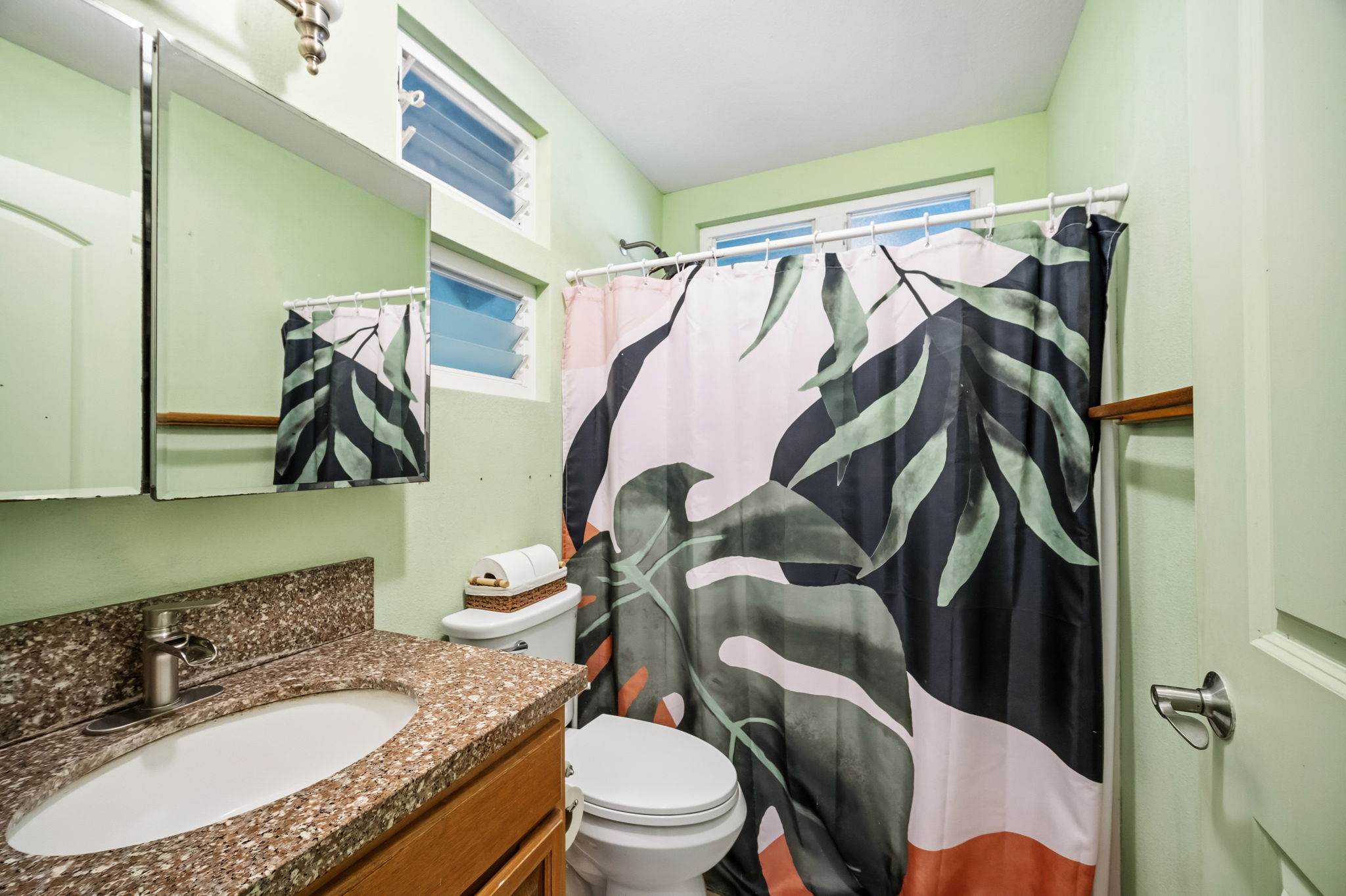 6250 Olohena Road, Unit 2 Kapaa, HI 96746 - Photo 16 of 29 a bathroom with a granite countertop sink toilet and a mirror