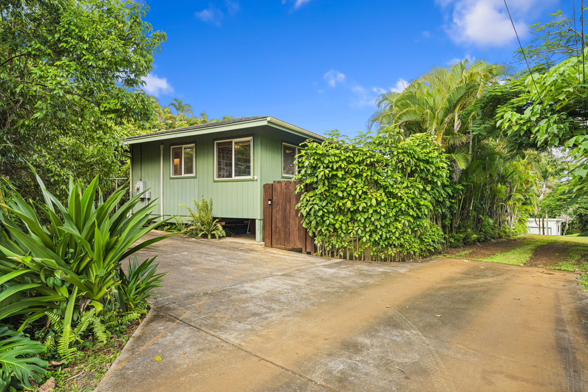 6250 Olohena Road, Unit 2 Kapaa, HI 96746 - Photo 5 of 29 a front view of a house with a yard
