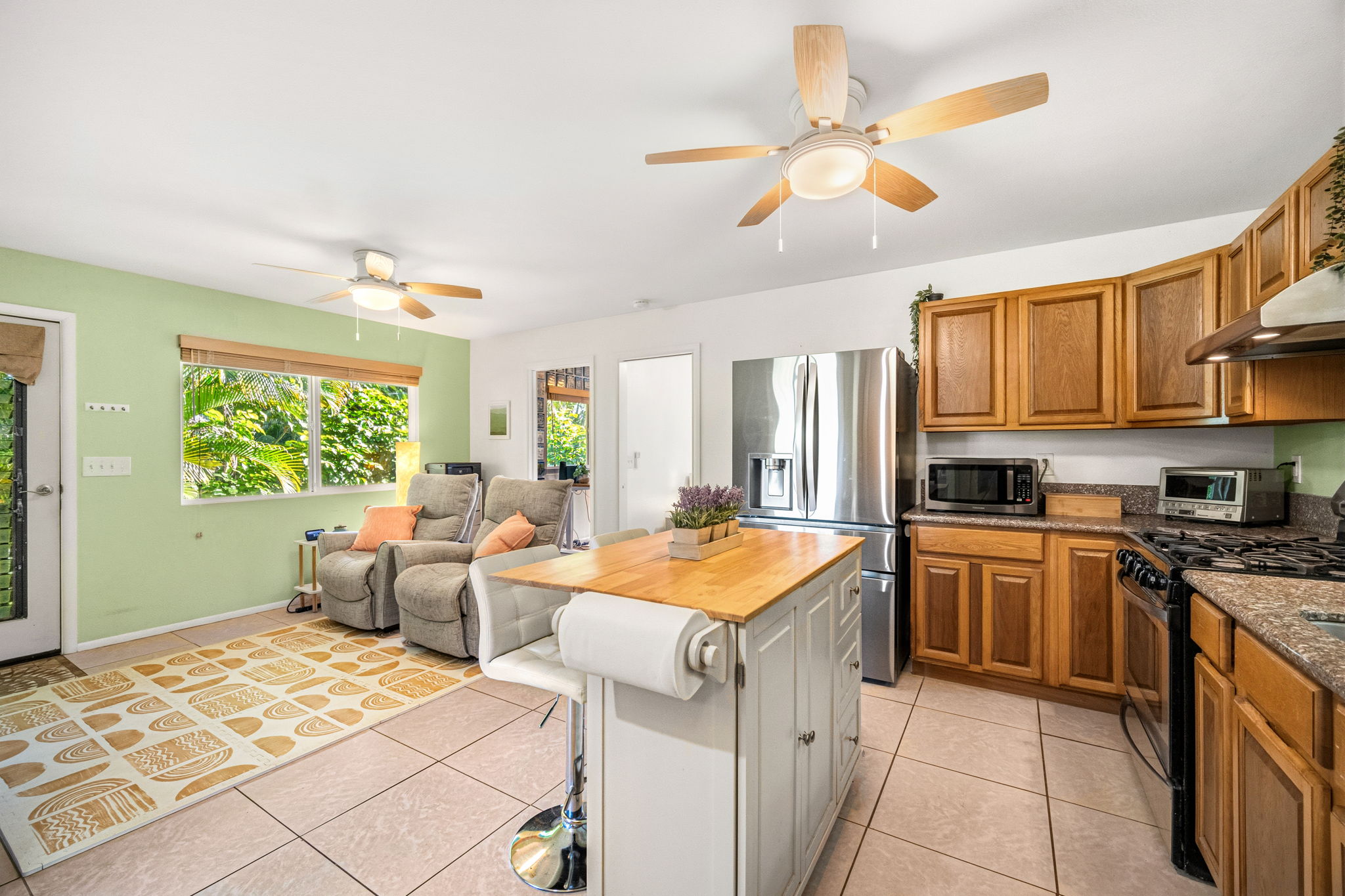 6250 Olohena Road, Unit 2 Kapaa, HI 96746 - Photo 8 of 29 a kitchen with stainless steel appliances granite countertop a sink and cabinets