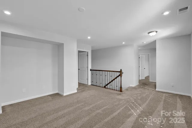 a spacious bedroom with a bed and a couch