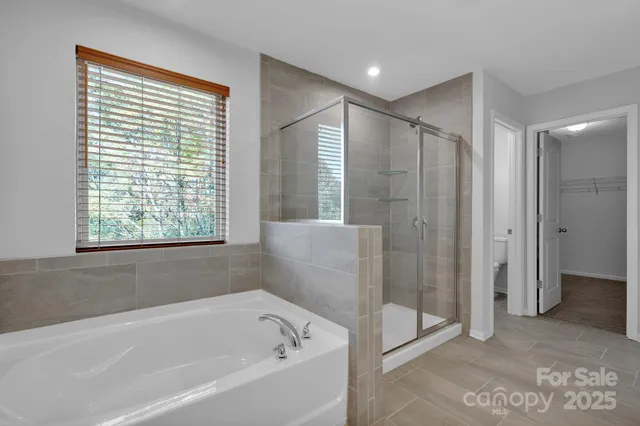 a bathroom with a shower and a sink