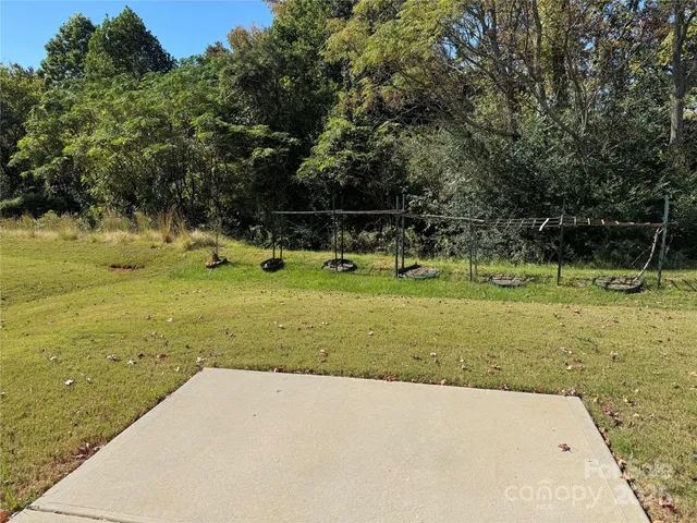 an aerial view of a house with a swimming pool