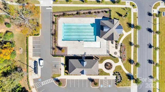 a view of a house with a yard from a balcony