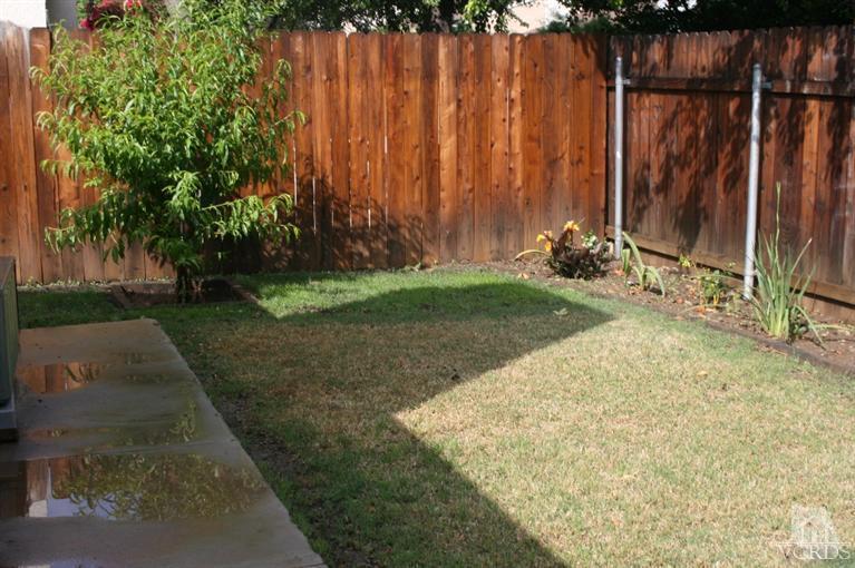 5689 Cochran Street Simi Valley, CA 93063 - Photo 6 of 13 a view of a backyard with wooden fence