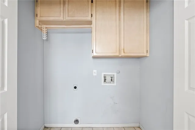 a white bath tub sitting next to a shower