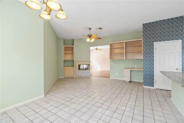 a view of a kitchen with furniture and a chandelier