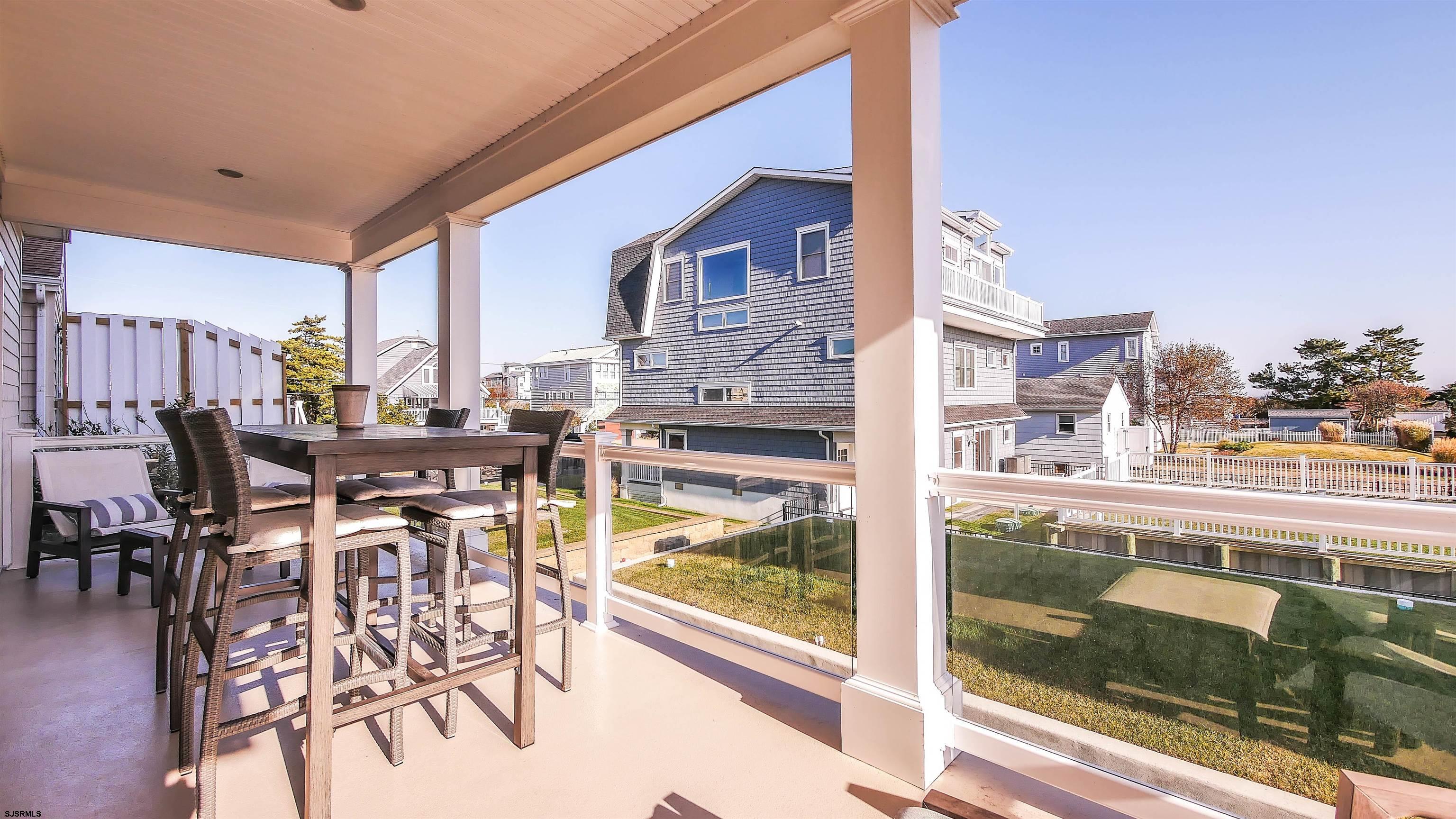 9 Commonwealth Avenue Strathmere, NJ 08248 - Photo 12 of 51 a view of a city from a dining room with furniture