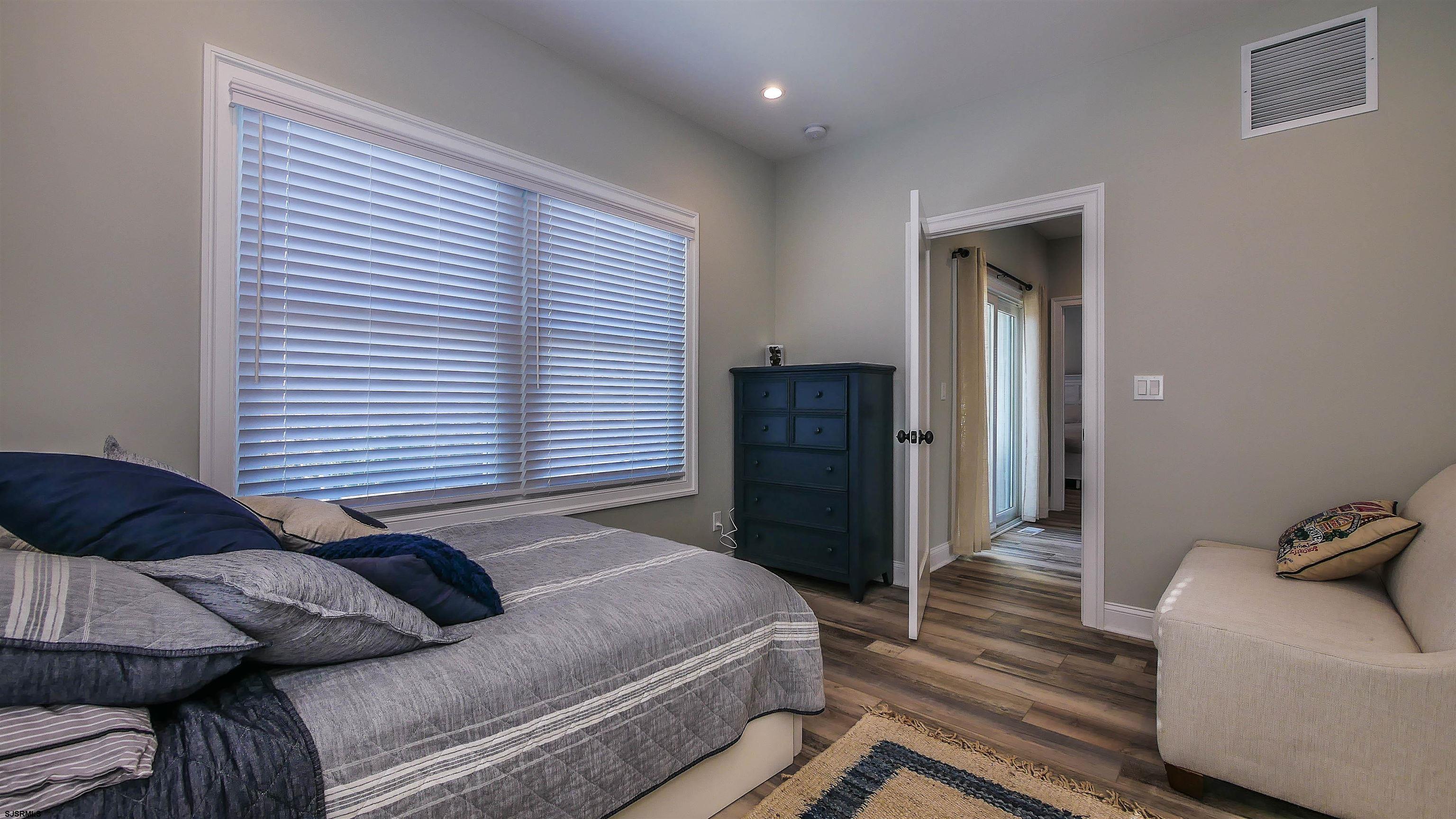 9 Commonwealth Avenue Strathmere, NJ 08248 - Photo 15 of 51 a bedroom with a bed and a couch