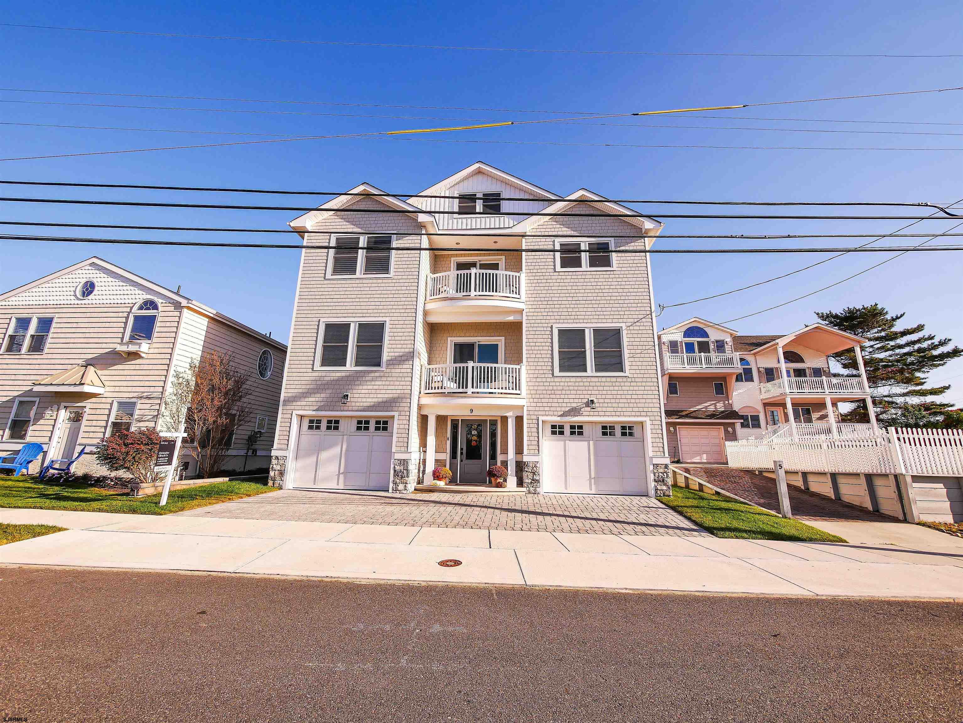 9 Commonwealth Avenue Strathmere, NJ 08248 - Photo 2 of 51 a front view of a building with a street