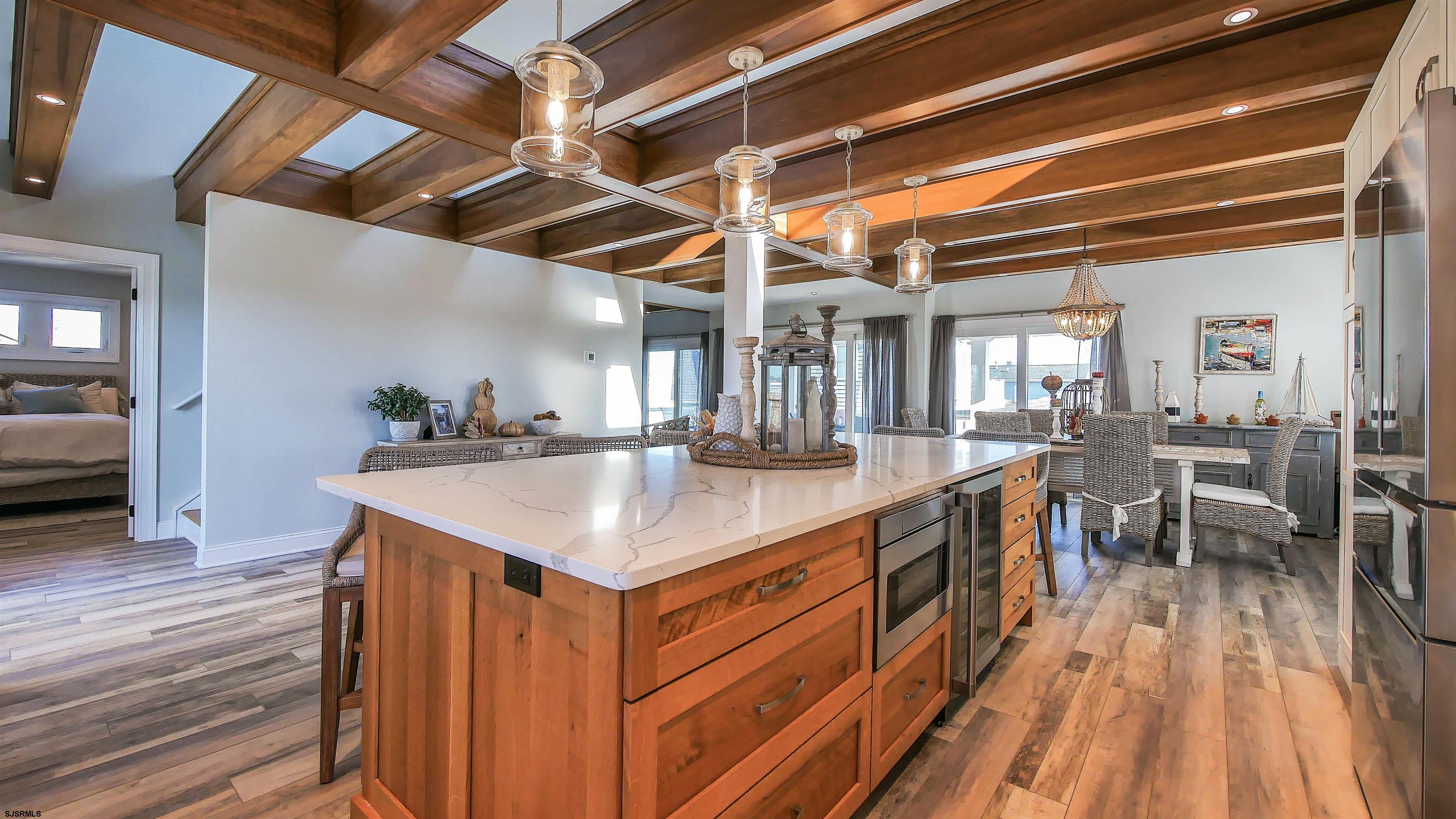 9 Commonwealth Avenue Strathmere, NJ 08248 - Photo 28 of 51 a kitchen with a sink and wooden floor