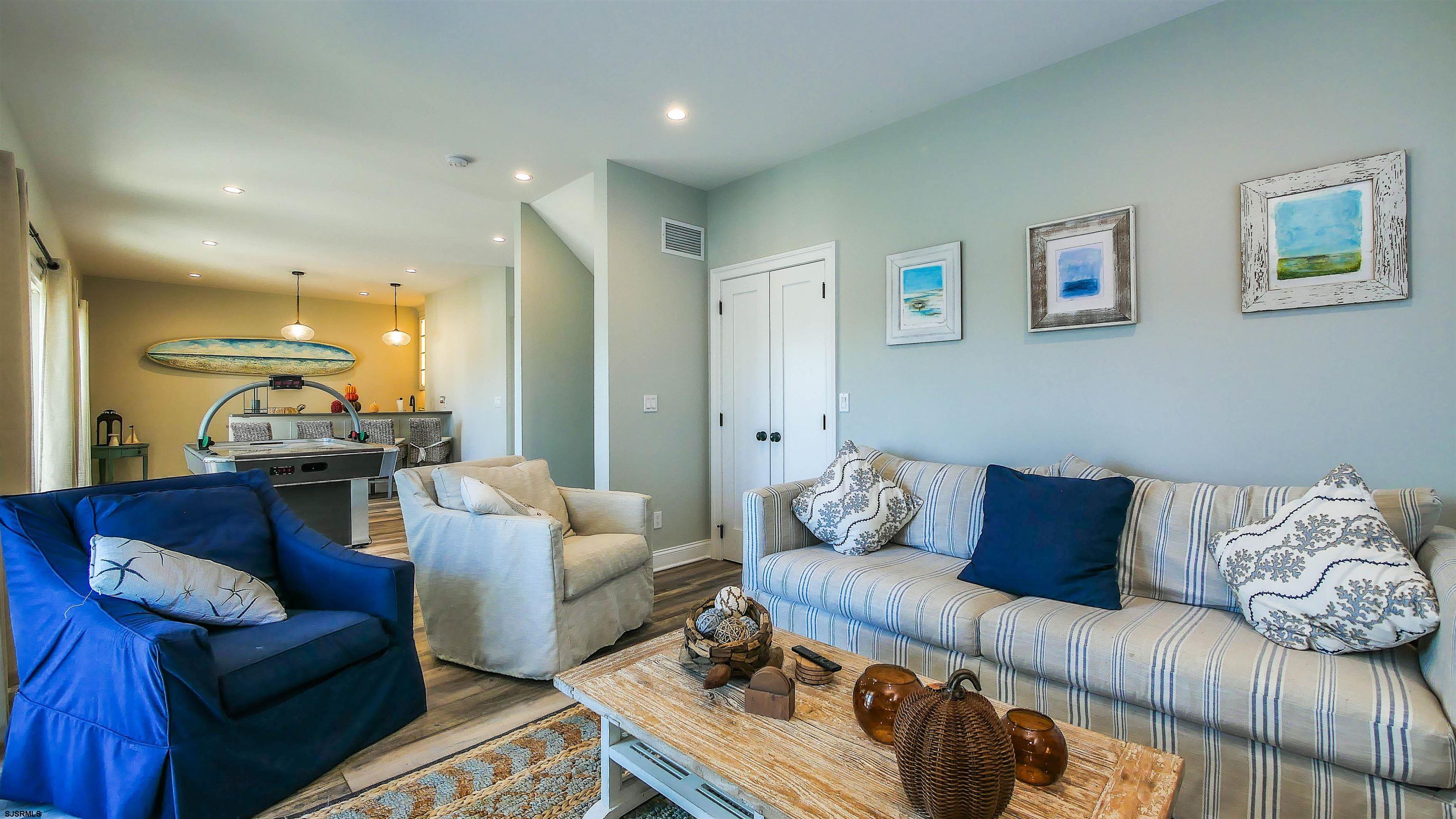 9 Commonwealth Avenue Strathmere, NJ 08248 - Photo 7 of 51 a living room with furniture and a couch