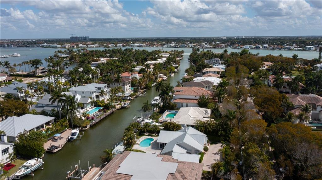 675 18th Avenue South Naples, FL 34102 - Photo 11 of 34 an aerial view of a city with lots of residential buildings