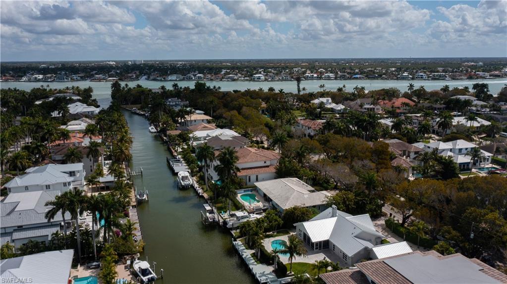 675 18th Avenue South Naples, FL 34102 - Photo 15 of 34 an aerial view of a city with lake view