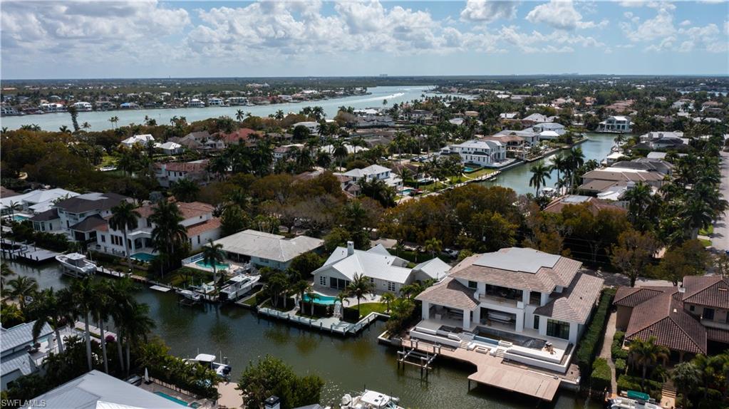 675 18th Avenue South Naples, FL 34102 - Photo 16 of 34 an aerial view of a house with a lake view