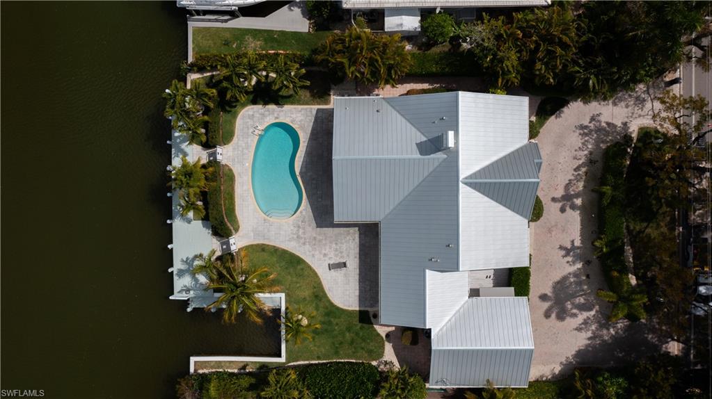 675 18th Avenue South Naples, FL 34102 - Photo 17 of 34 an aerial view of a house with swimming pool and outdoor space