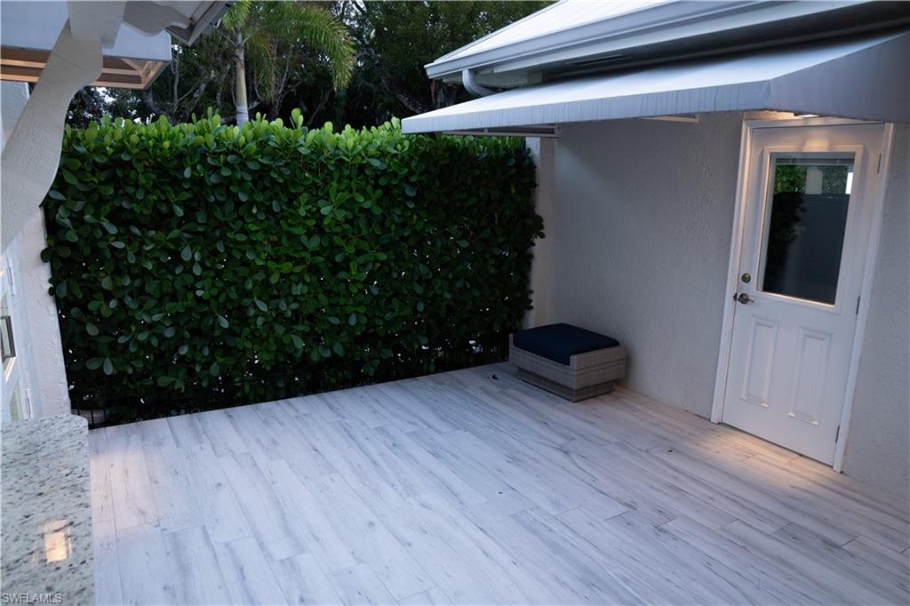 675 18th Avenue South Naples, FL 34102 - Photo 18 of 34 a view of outdoor space and wooden floor