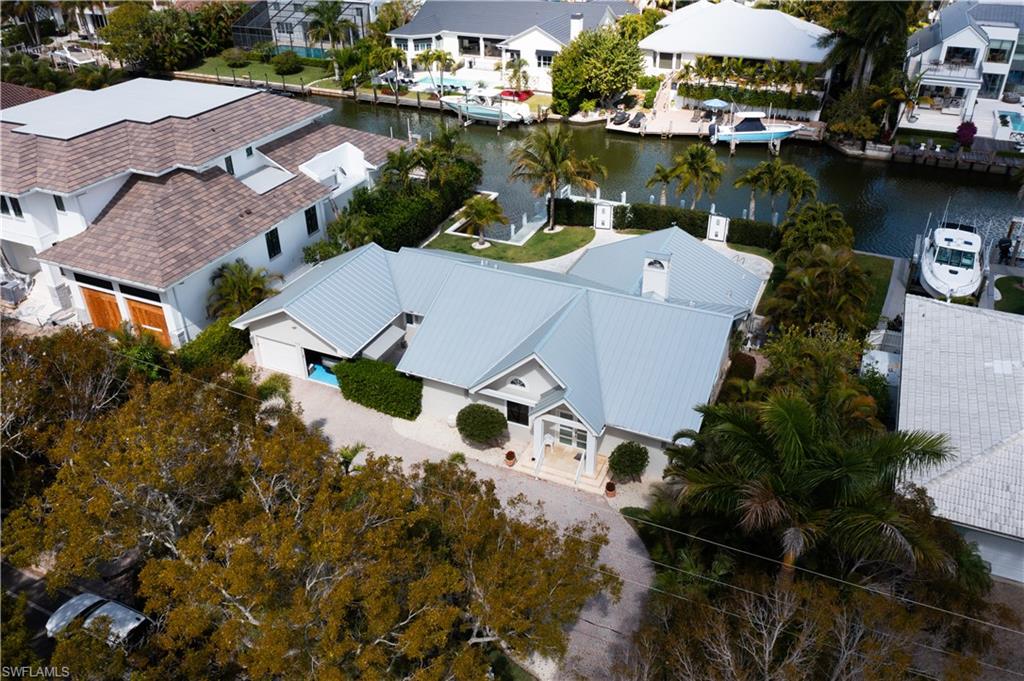 675 18th Avenue South Naples, FL 34102 - Photo 2 of 34 an aerial view of a house with a lake view