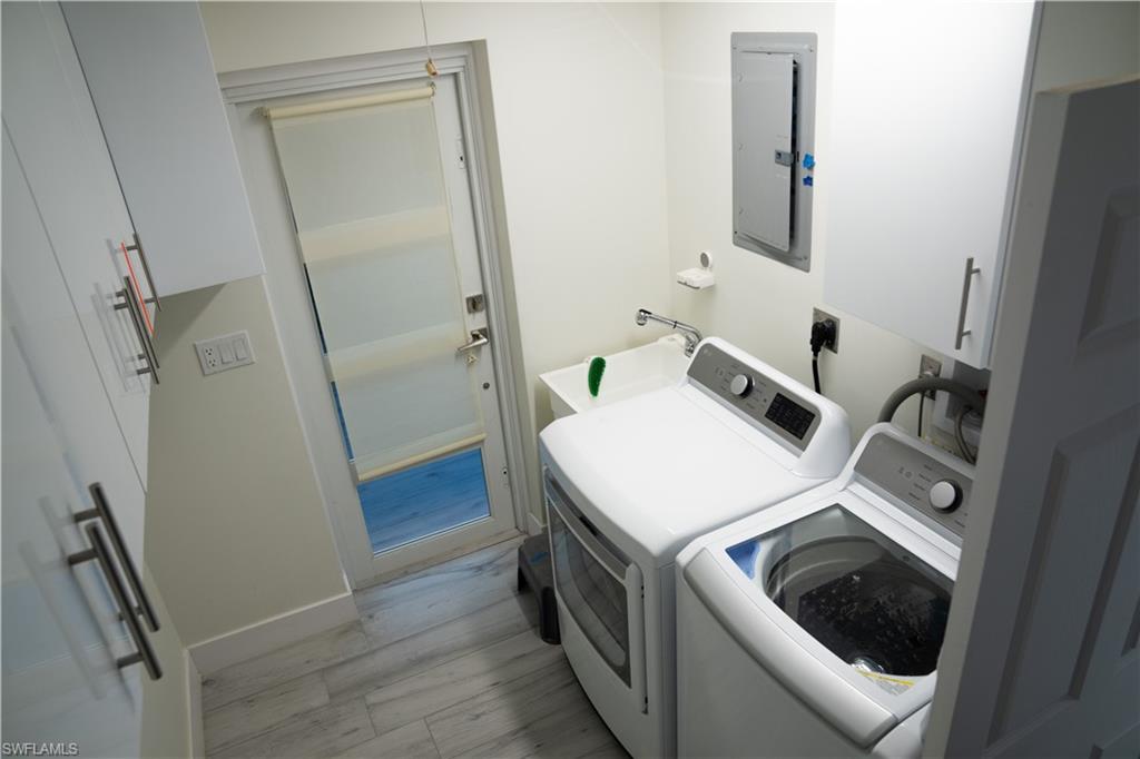 675 18th Avenue South Naples, FL 34102 - Photo 23 of 34 a utility room with dryer and washer