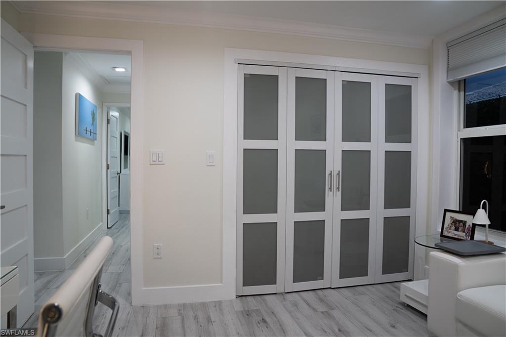 675 18th Avenue South Naples, FL 34102 - Photo 26 of 34 a view of wooden floor and windows in a room