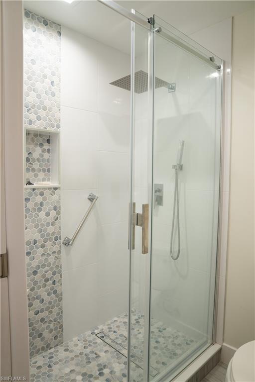 675 18th Avenue South Naples, FL 34102 - Photo 29 of 34 a bathroom with a shower