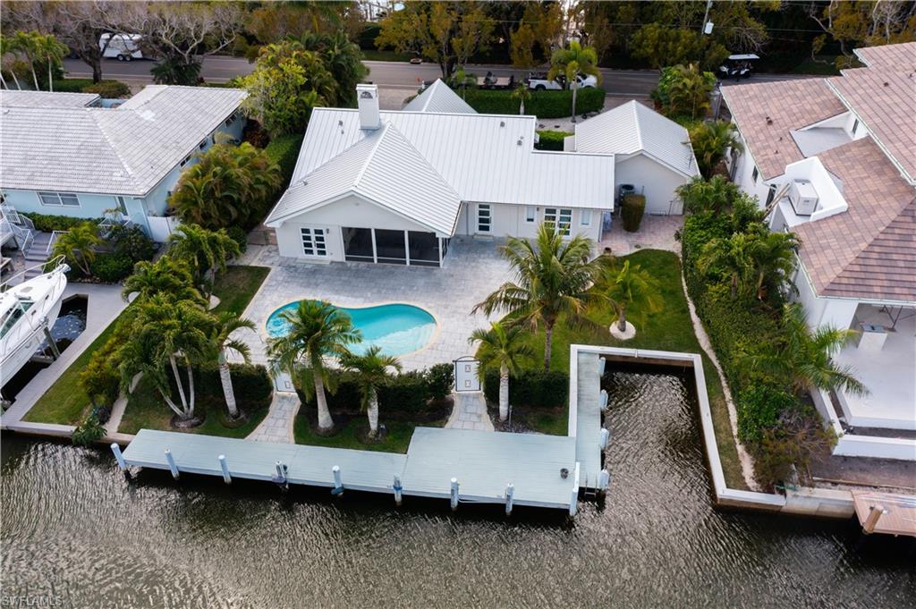 675 18th Avenue South Naples, FL 34102 - Photo 3 of 34 an aerial view of a house with garden space and sitting area
