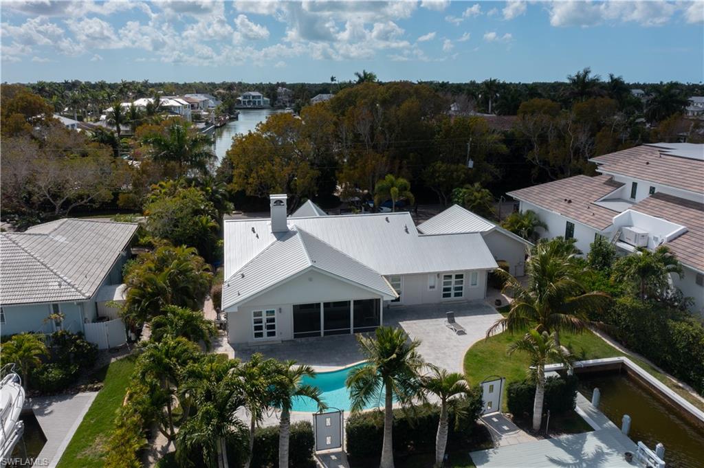 675 18th Avenue South Naples, FL 34102 - Photo 4 of 34 an aerial view of a house with a yard