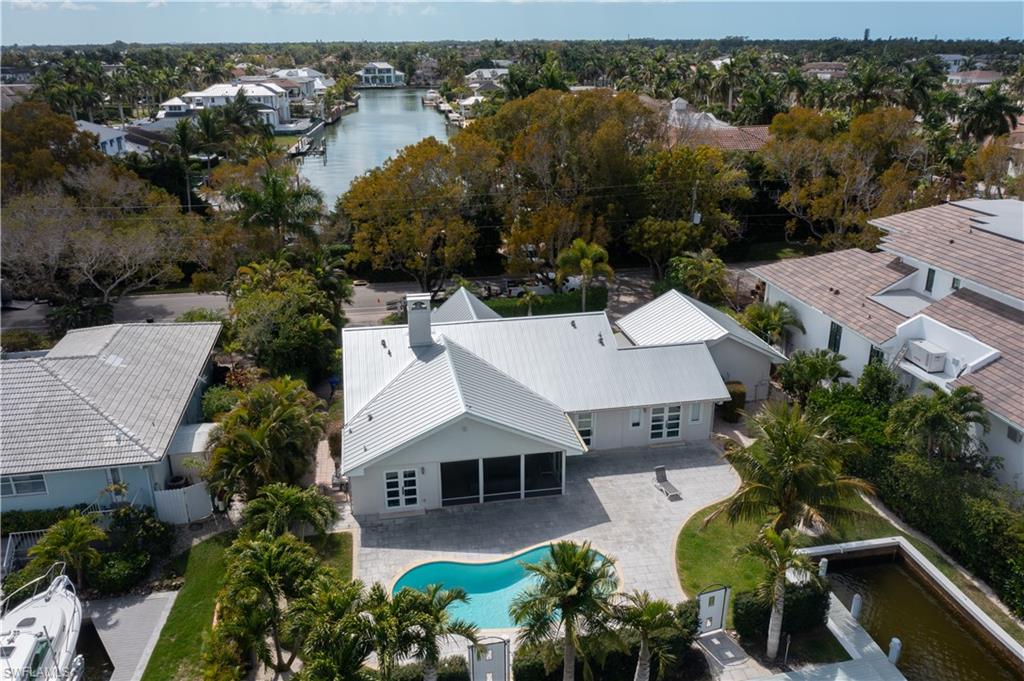 675 18th Avenue South Naples, FL 34102 - Photo 8 of 34 an aerial view of a house with swimming pool and outdoor space