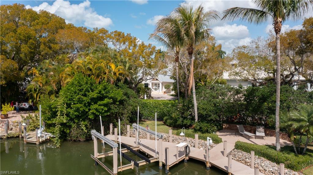 675 18th Avenue South Naples, FL 34102 - Photo 10 of 34 a view of a lake with houses