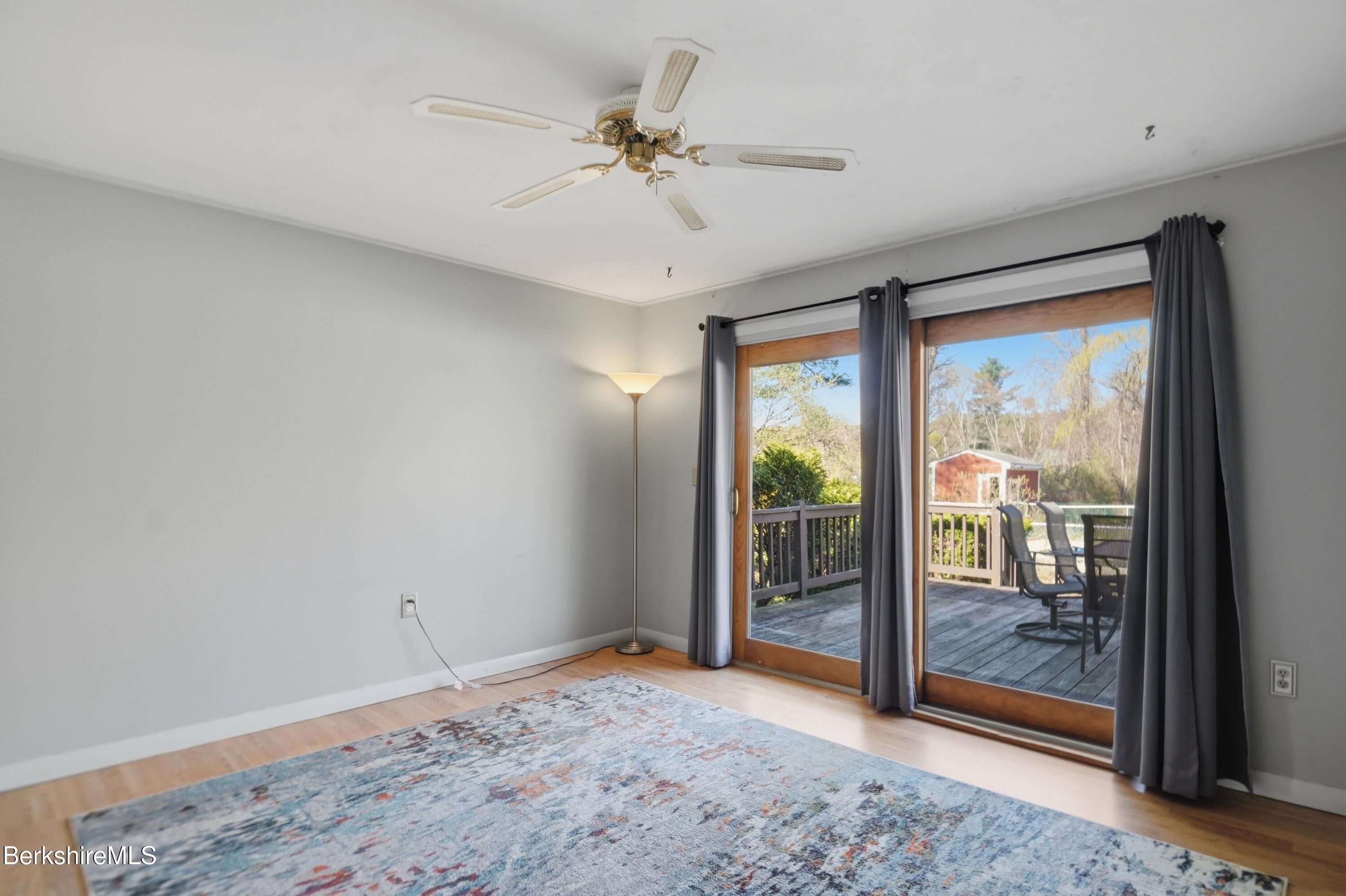 55 Tower Road Dalton, MA 01226 - Photo 13 of 47 a view of a livingroom with a ceiling fan and a large window