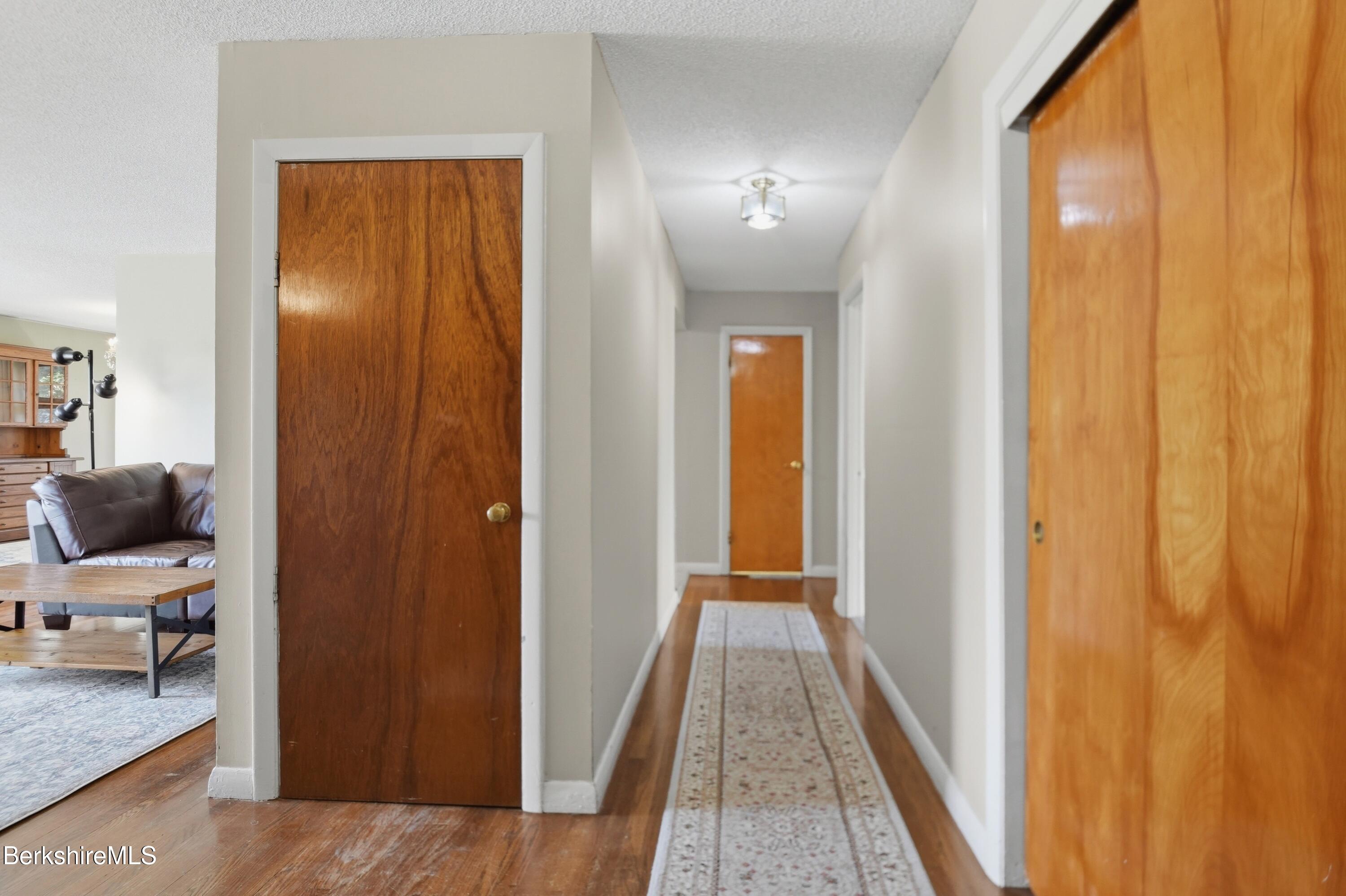 55 Tower Road Dalton, MA 01226 - Photo 23 of 47 a view of a hallway and a livingroom with furniture