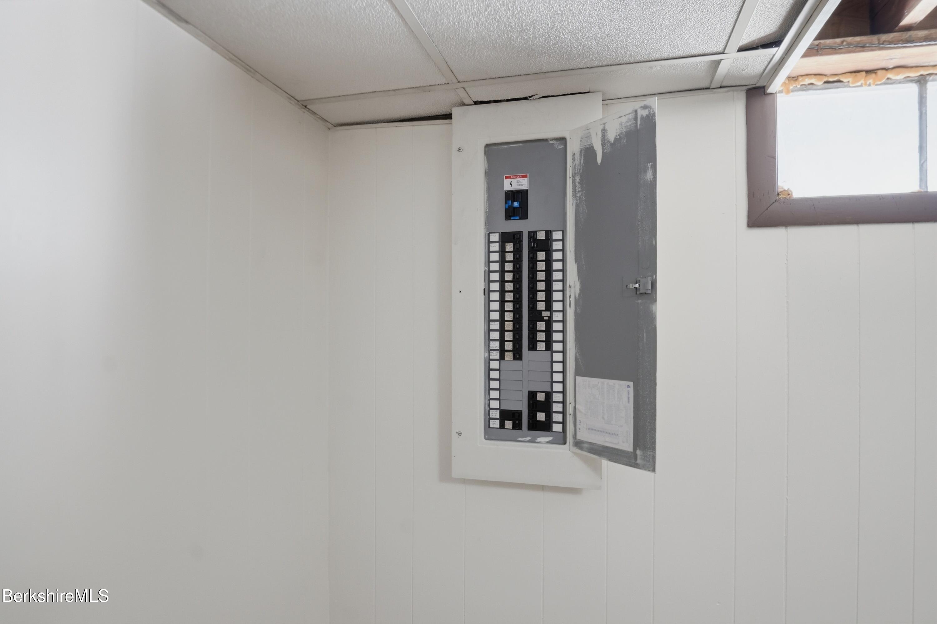 55 Tower Road Dalton, MA 01226 - Photo 35 of 47 a white painted wall with a white cabinet