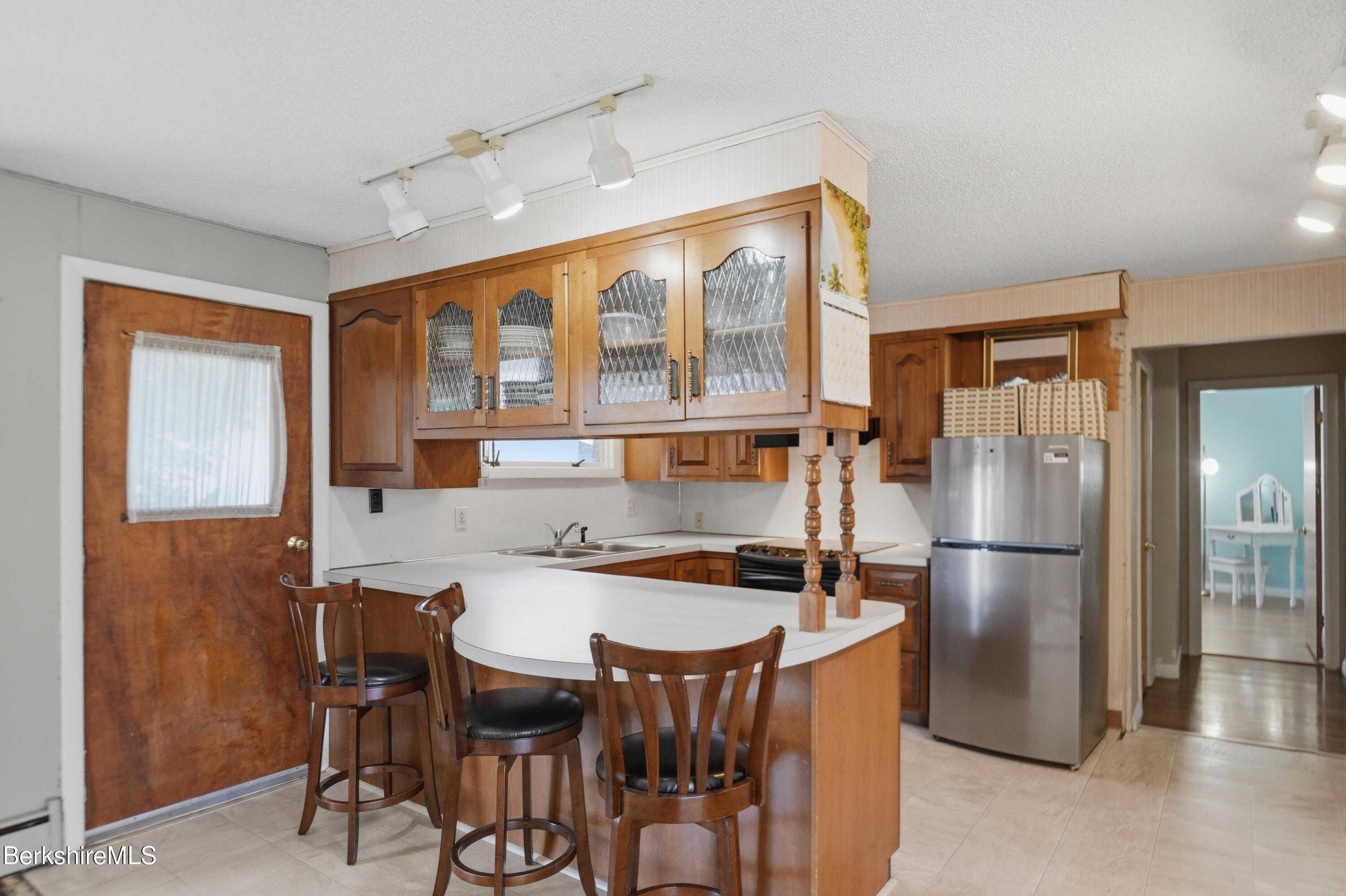 55 Tower Road Dalton, MA 01226 - Photo 5 of 47 a kitchen with a table and chairs
