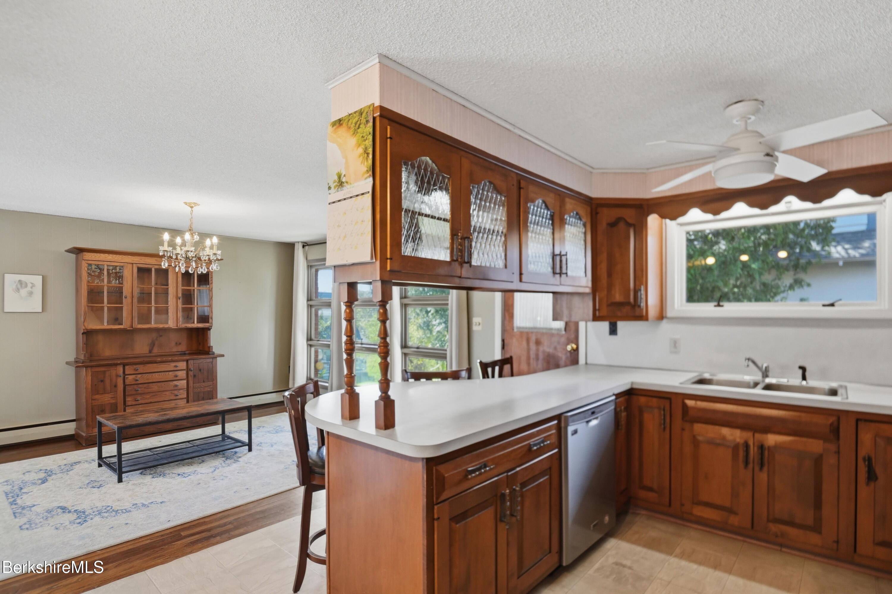 55 Tower Road Dalton, MA 01226 - Photo 6 of 47 a kitchen with stainless steel appliances granite countertop a sink and a stove