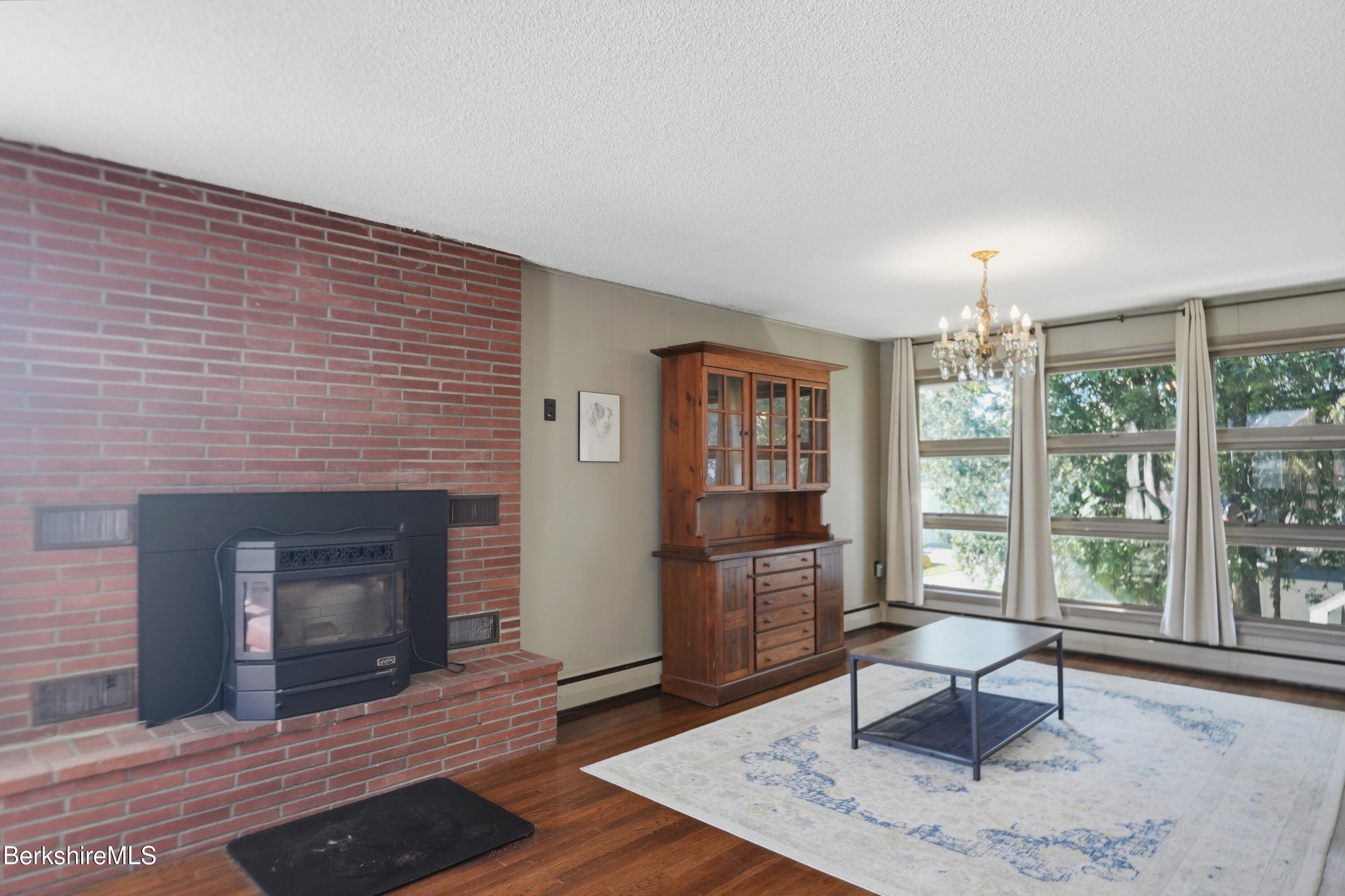 55 Tower Road Dalton, MA 01226 - Photo 7 of 47 a living room with furniture and a fireplace