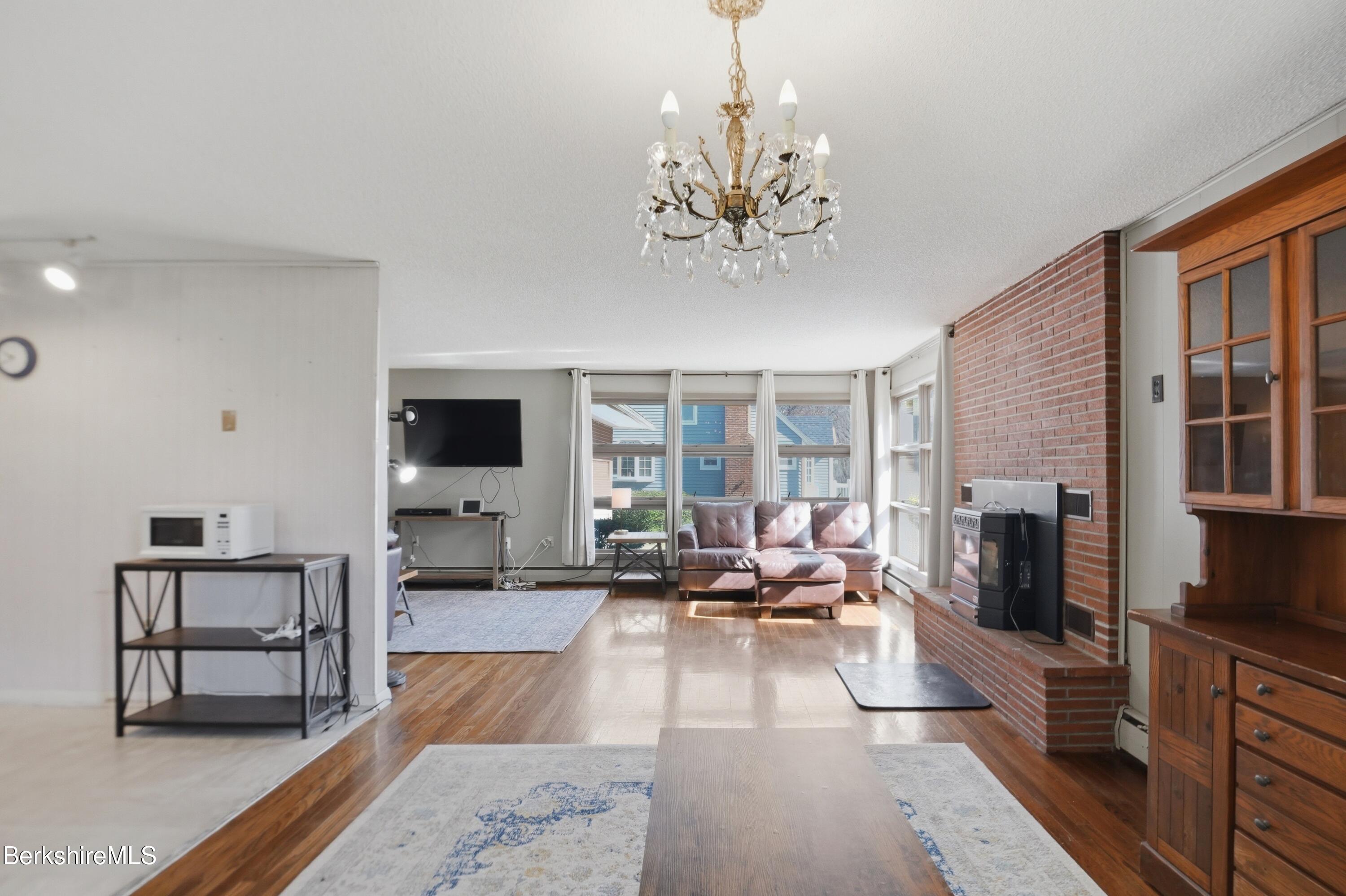 55 Tower Road Dalton, MA 01226 - Photo 9 of 47 a living room with fireplace furniture and a flat screen tv