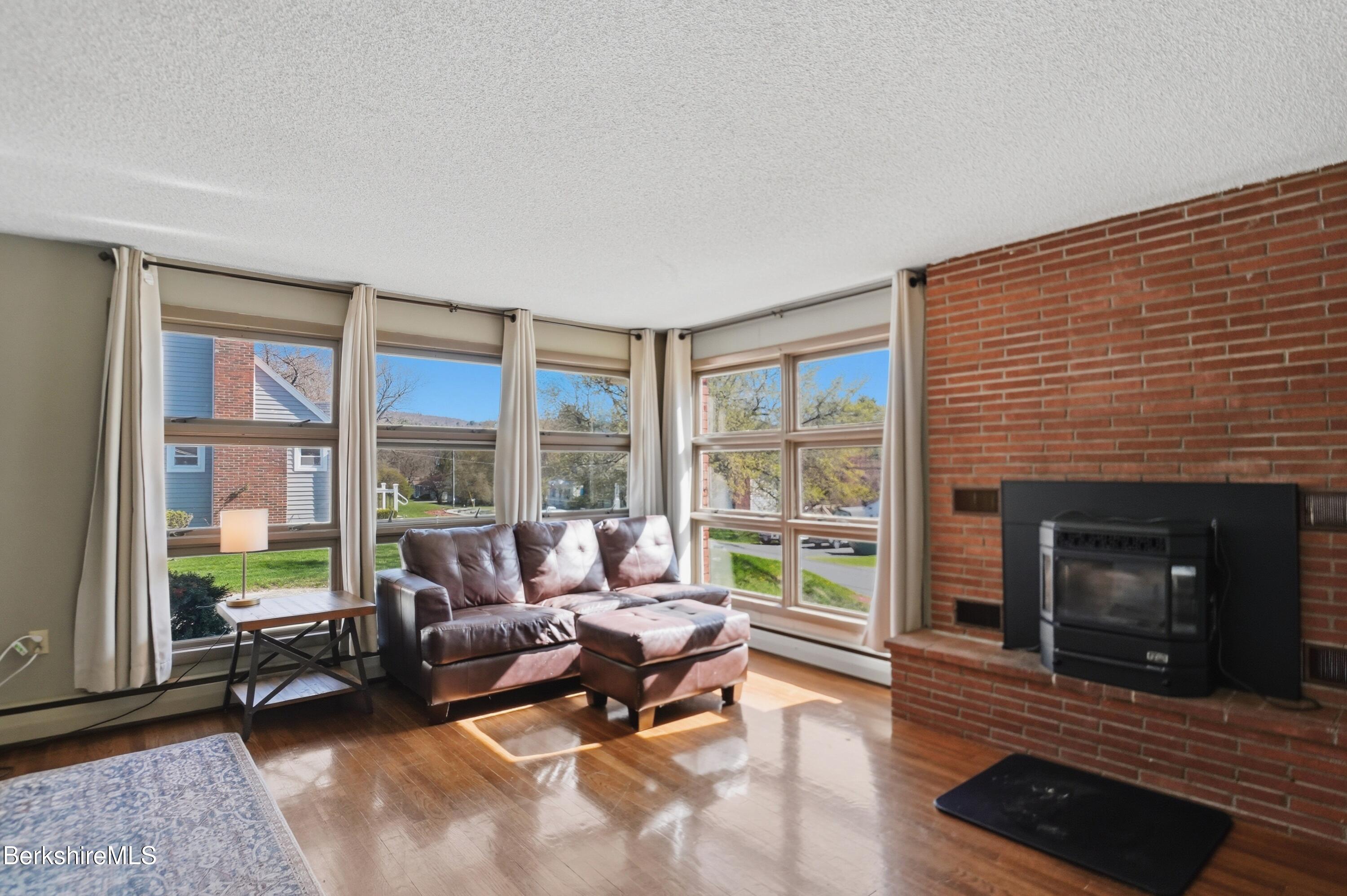 55 Tower Road Dalton, MA 01226 - Photo 10 of 47 a living room with furniture and a fireplace