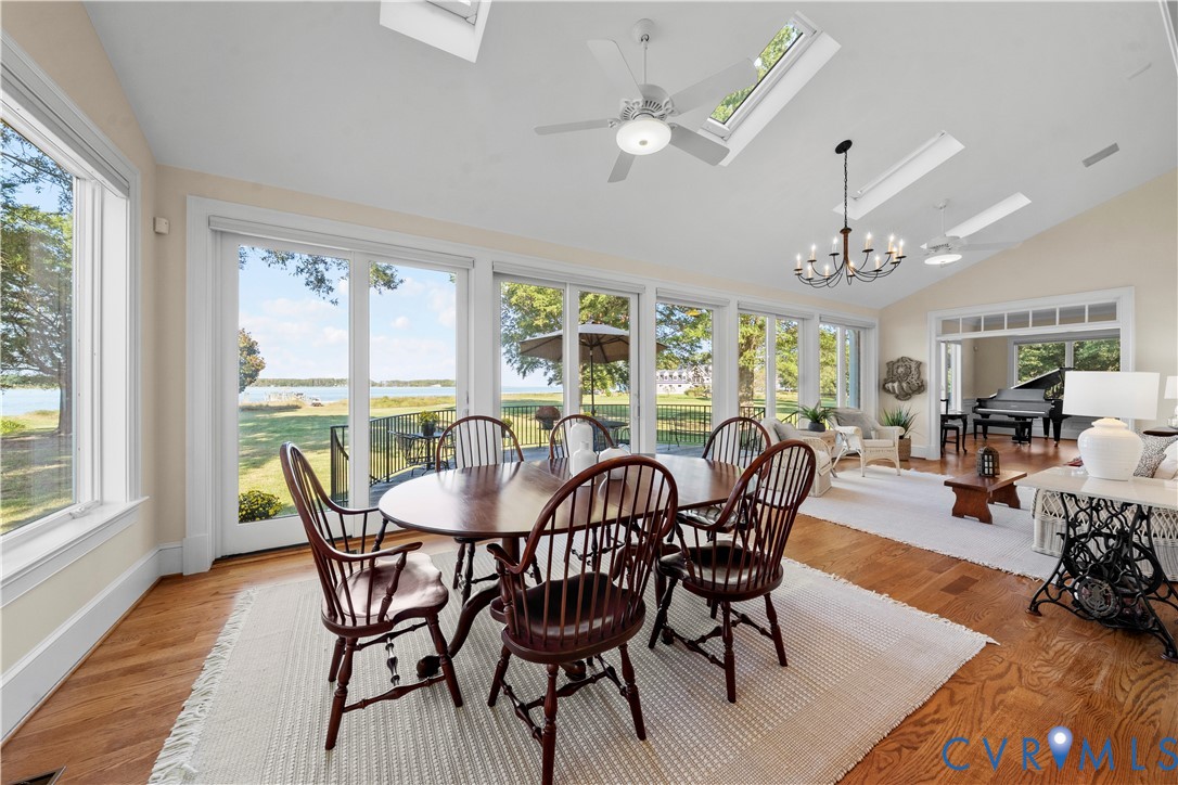 2515 Fleet's Bay Road White Stone, VA 22578 - Photo 7 of 74 a view of a dining room with furniture window and wooden floor