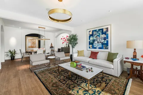 a kitchen with a sink stove and refrigerator