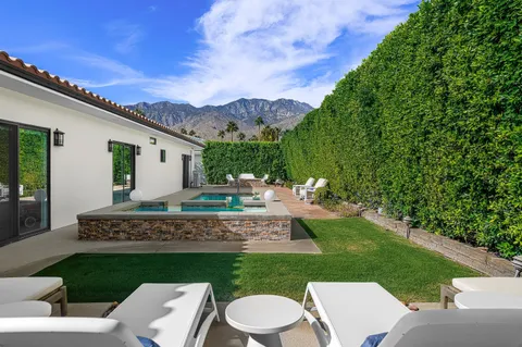 a patio with a table and chairs