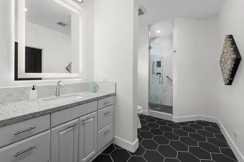 an aerial view of residential houses and outdoor space