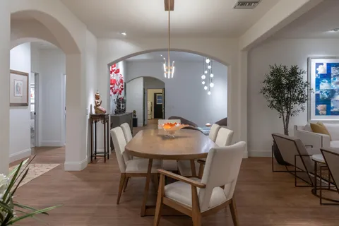 a view of a chairs and table in a patio