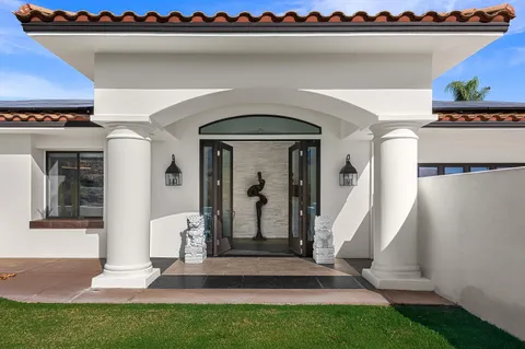 a living room with furniture and a rug