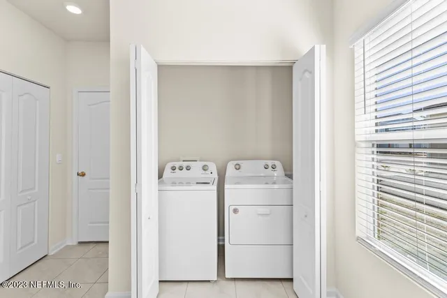 a utility room with dryer and washer
