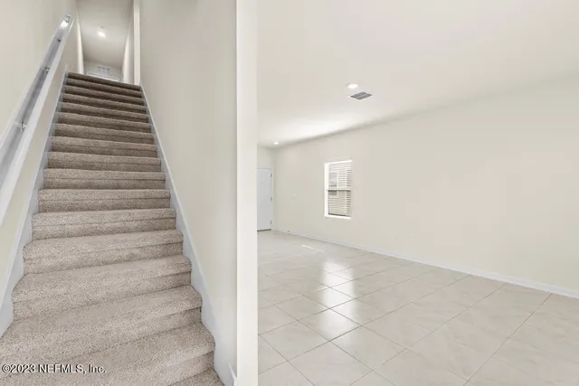 a view of a hallway with staircase