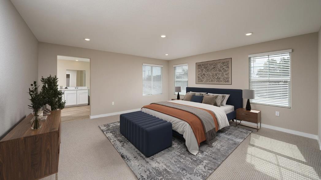 1156 Monique Street Galt, CA 95632 - Photo 15 of 17 a bedroom with a large bed and a potted plant