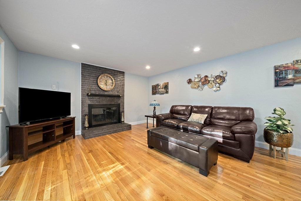 22 Fairview Road Canton, MA 02021 - Photo 11 of 42 a living room with furniture and a flat screen tv