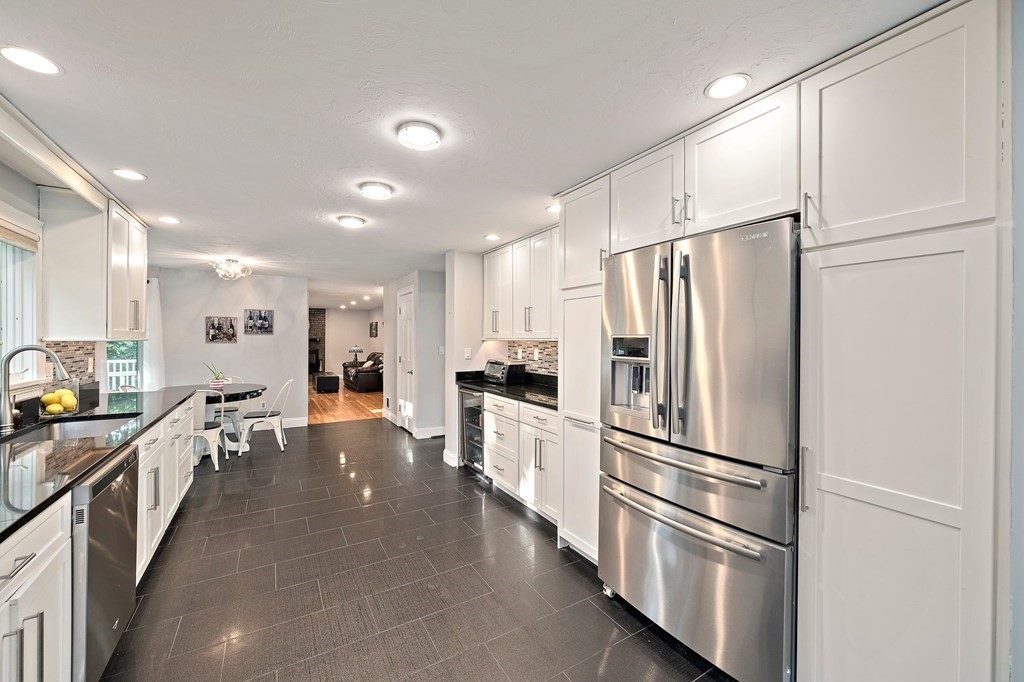 22 Fairview Road Canton, MA 02021 - Photo 18 of 42 a kitchen with stainless steel appliances a refrigerator and a stove top oven